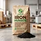 X-HUMATE 20kg organic iron humate fertilizer in eco-friendly kraft paper bag with English shipping mark, featured with a pile of black shiny humate granules on warehouse background.